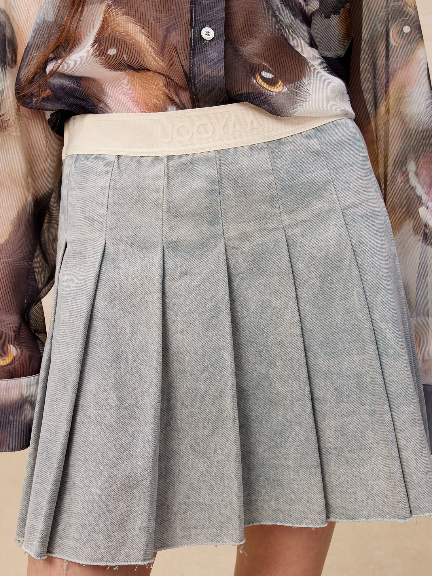Raw edge pleated washed denim skirt