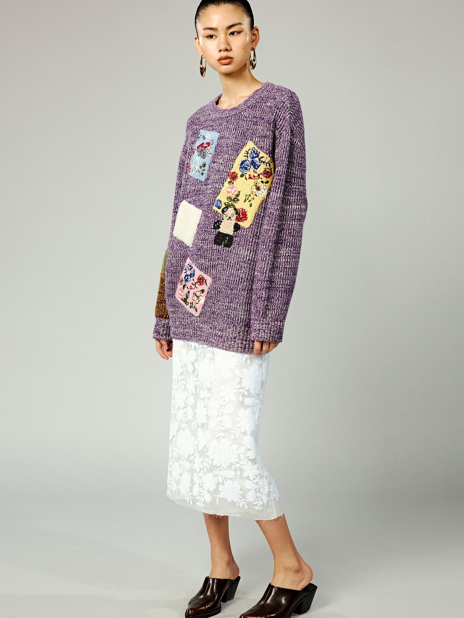 Vintage-inspired knit sweater with patches