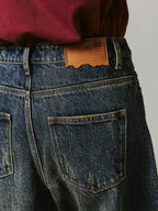 Washed curved blade jeans