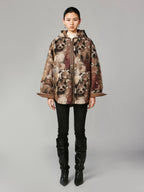 Hooded reversible blanket jacket covered with vintage plush toys