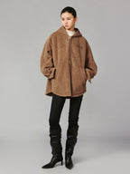Hooded reversible blanket jacket covered with vintage plush toys