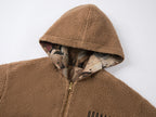 Hooded reversible blanket jacket covered with vintage plush toys