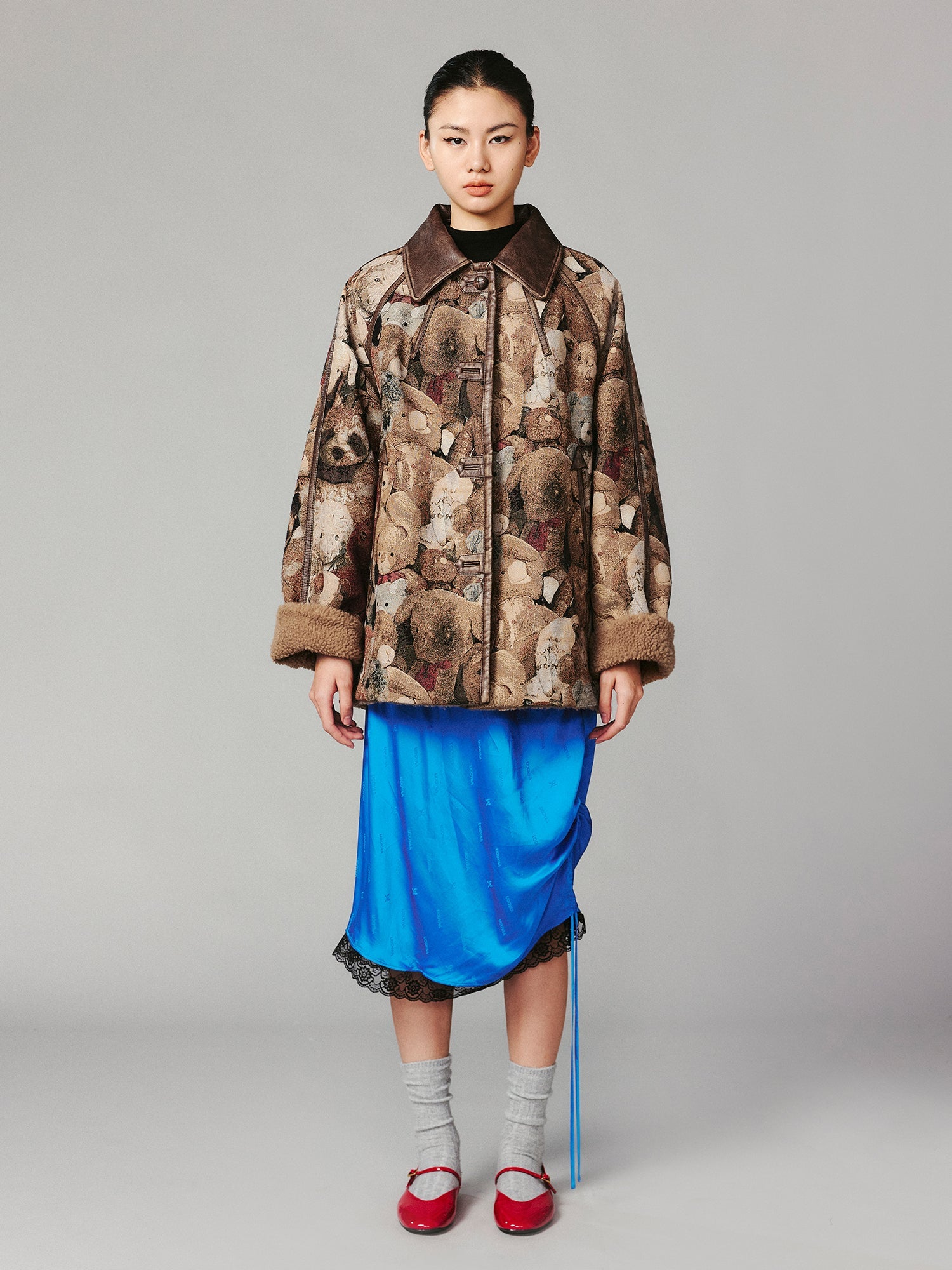 M35 blanket jacket covered with vintage plush toys