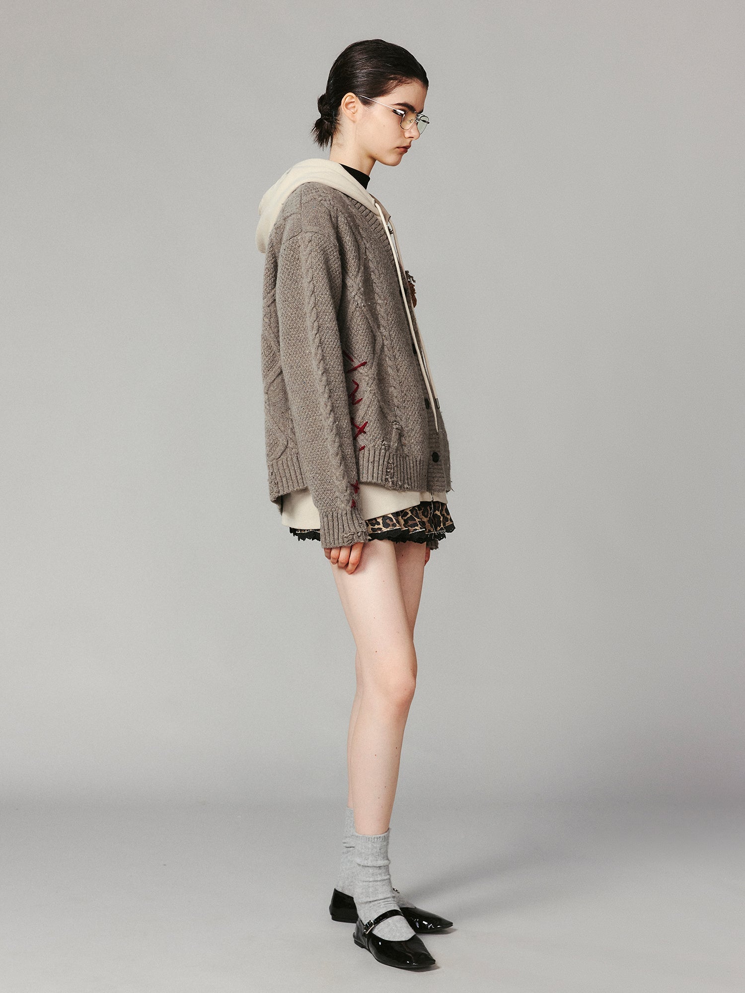 Layered look cable-knit hoodie with 3D bear peeking through