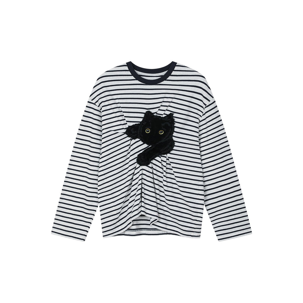 Playful cat scratching bedsheet striped T-shirt
