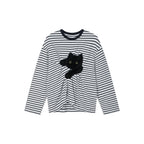 Playful cat scratching bedsheet striped T-shirt