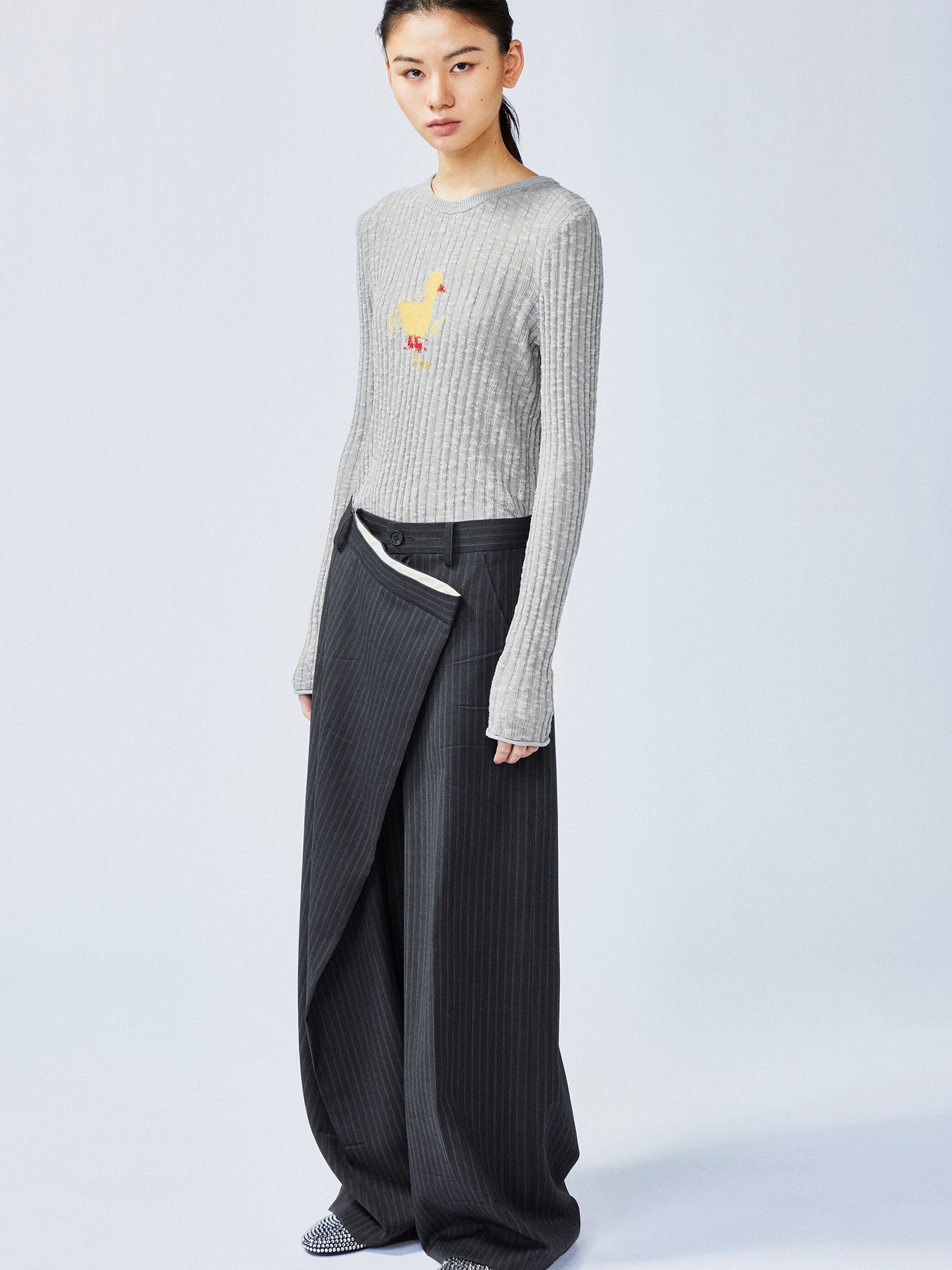 Pulled pleated suit pants with authentic wear marks