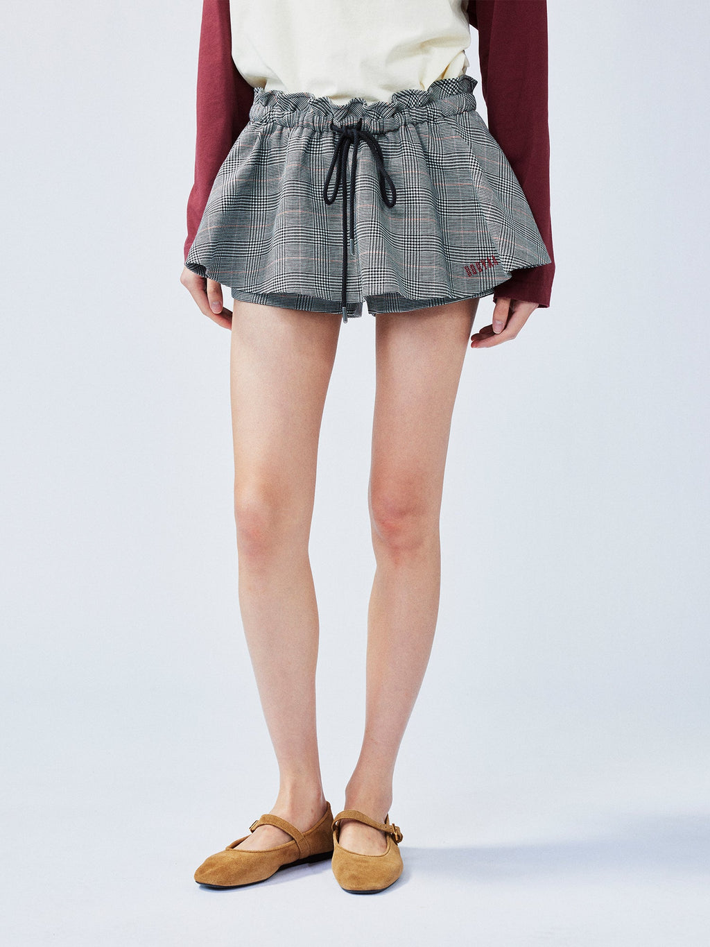 Playful and stylish finely woven plaid mini skirt with a hidden twist