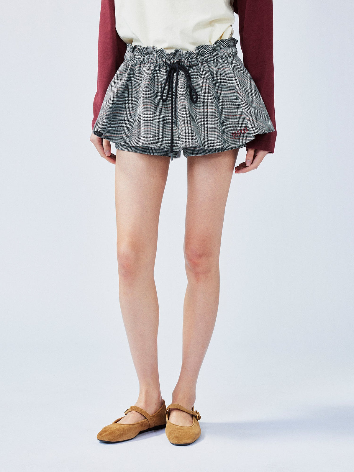 Playful and stylish finely woven plaid mini skirt with a hidden twist