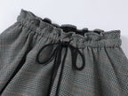 Playful and stylish finely woven plaid mini skirt with a hidden twist
