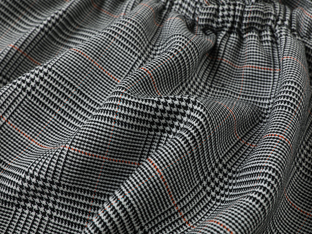Playful and stylish finely woven plaid mini skirt with a hidden twist