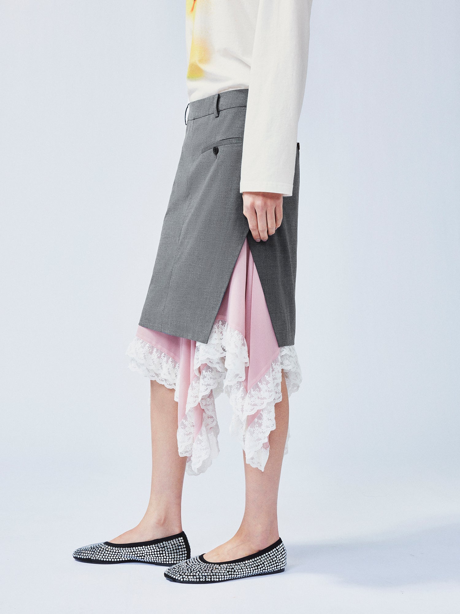 A misaligned suit layered-look skirt