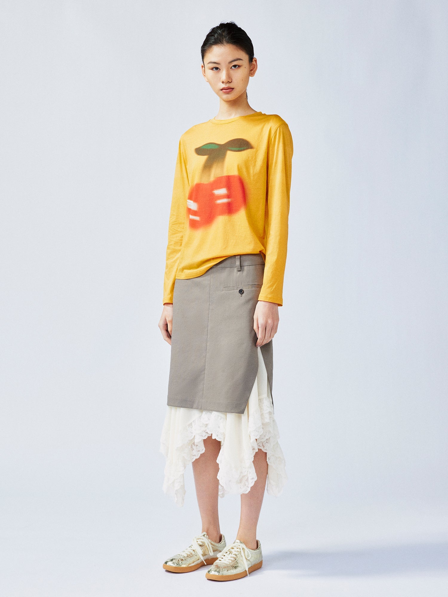 A misaligned suit layered-look skirt