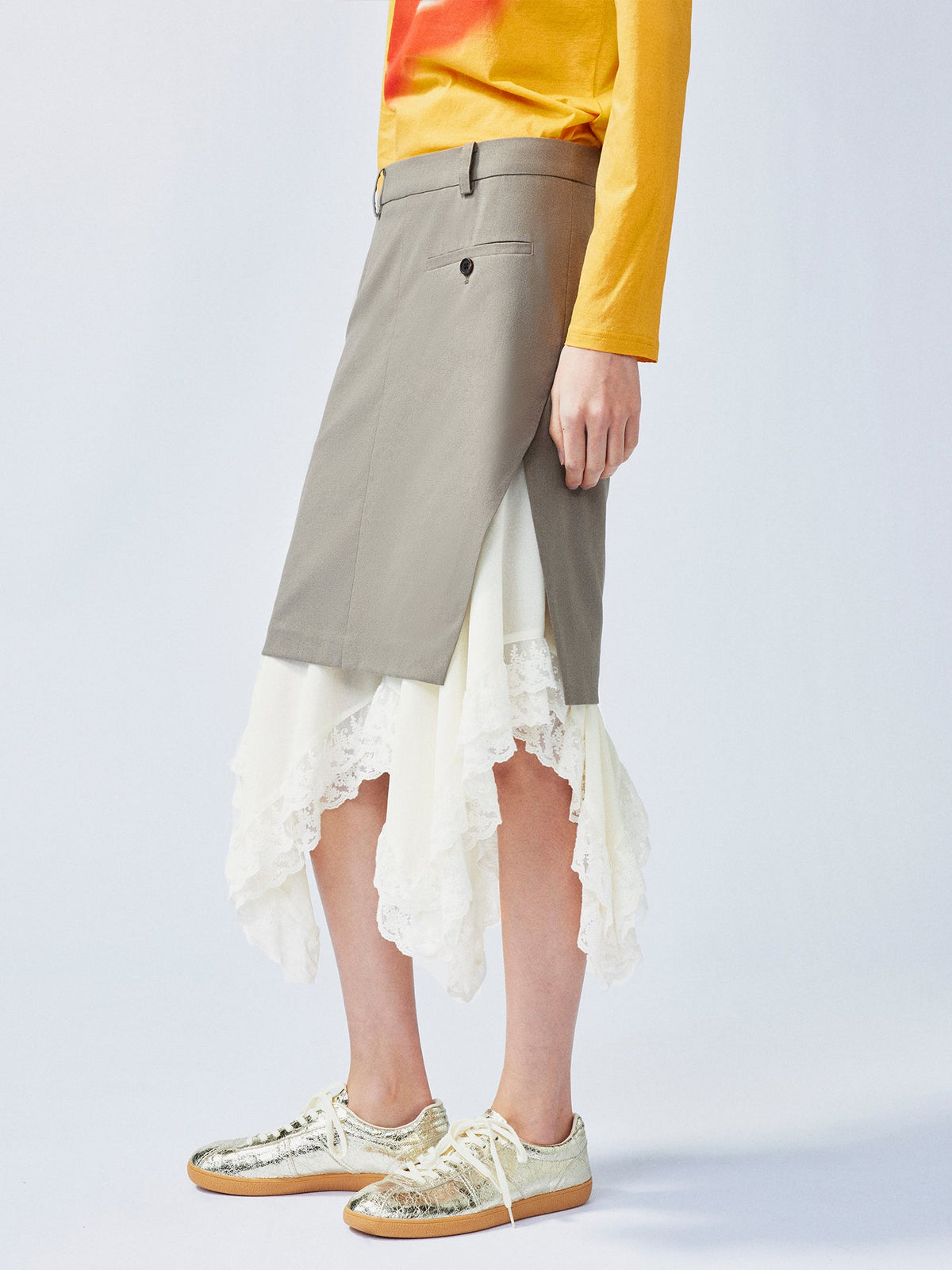 A misaligned suit layered-look skirt