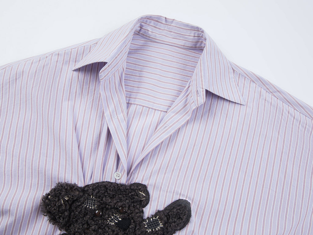 Playful puppy biting shirt