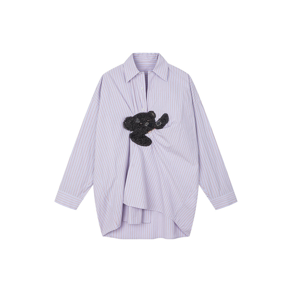 Playful puppy biting shirt