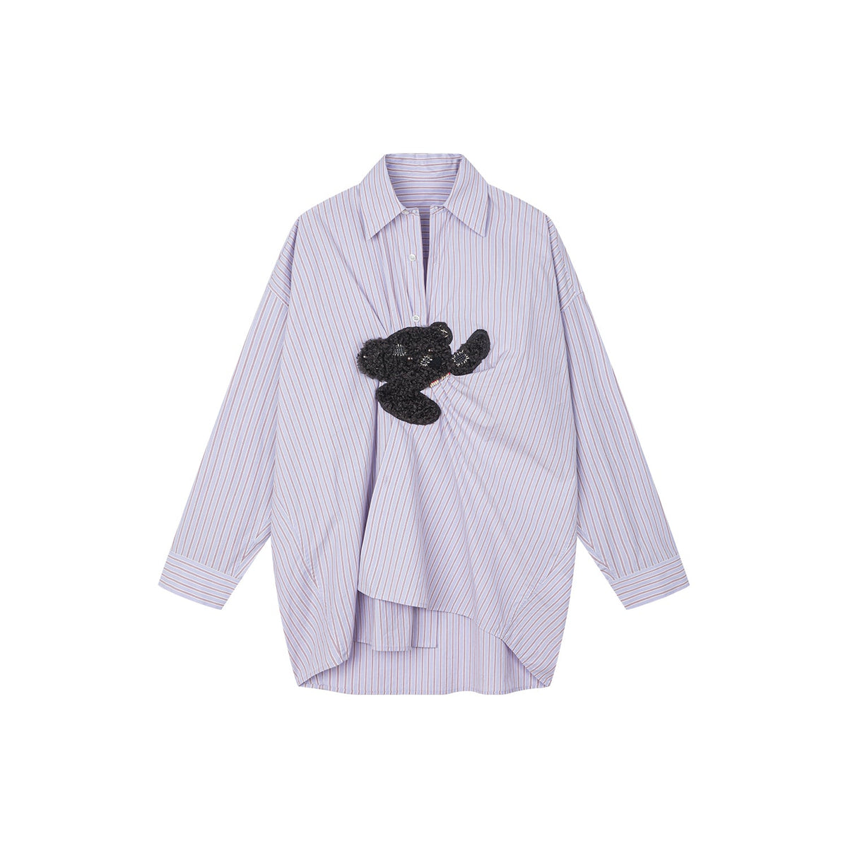 Playful puppy biting shirt
