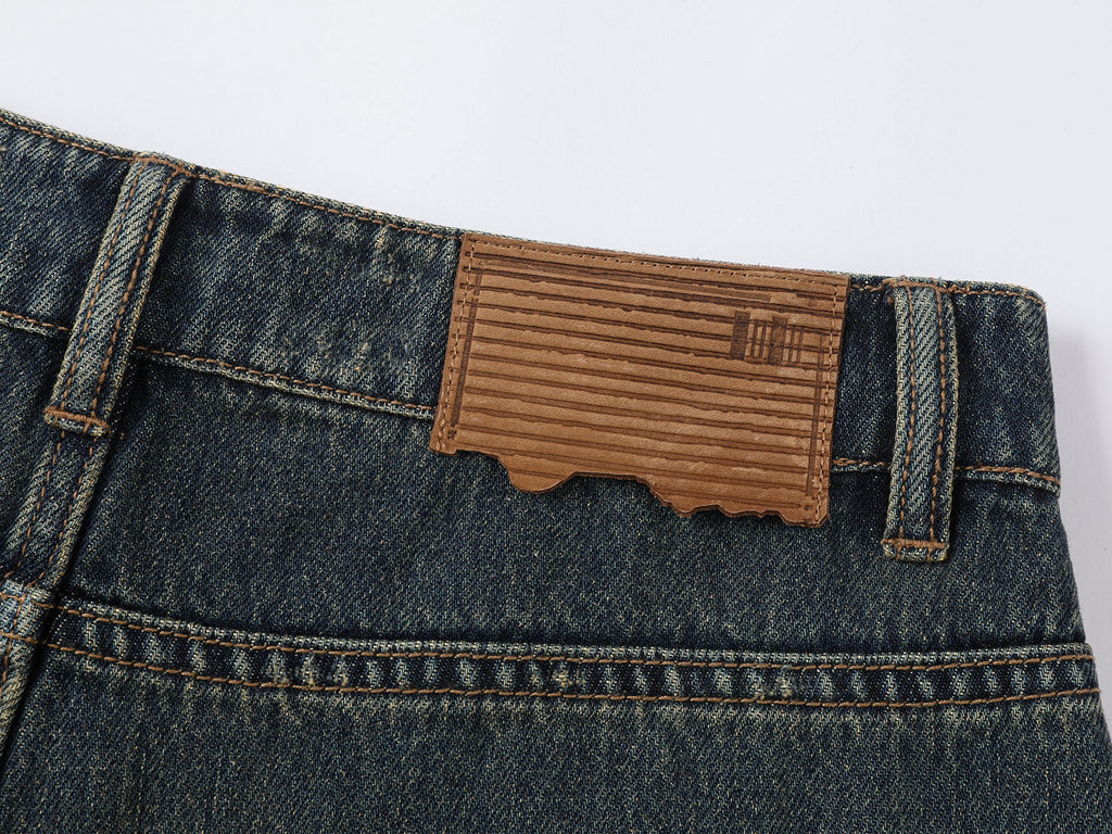 Wardrobe essential distressed wash scythe-cut jeans