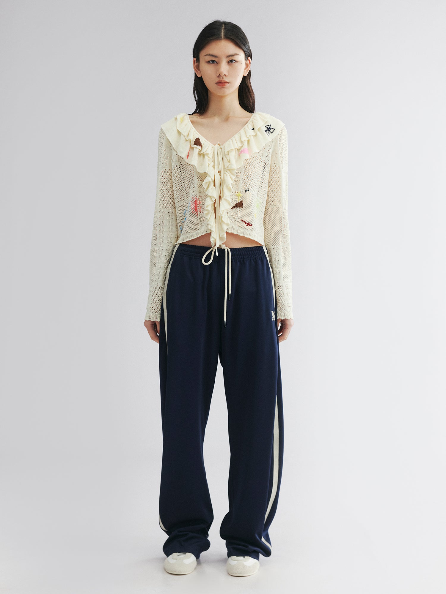 Handcrafted patch cardigan with ruffled edges