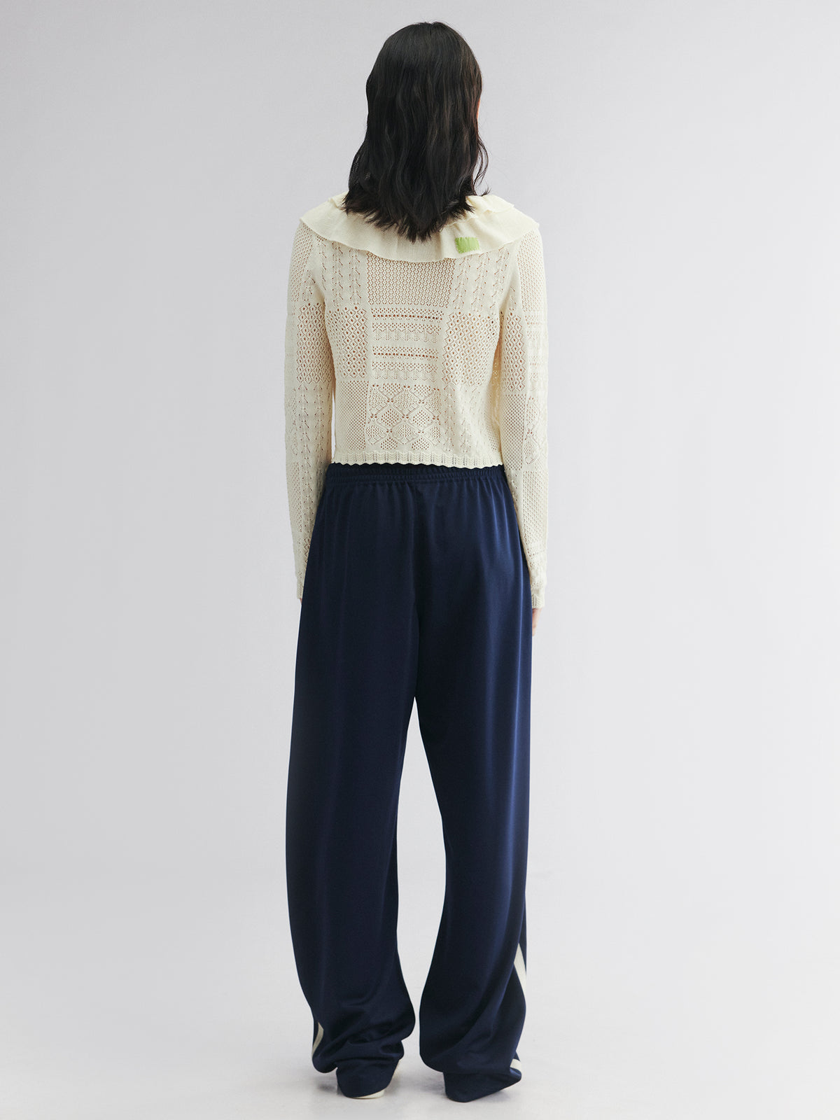 Handcrafted patch cardigan with ruffled edges