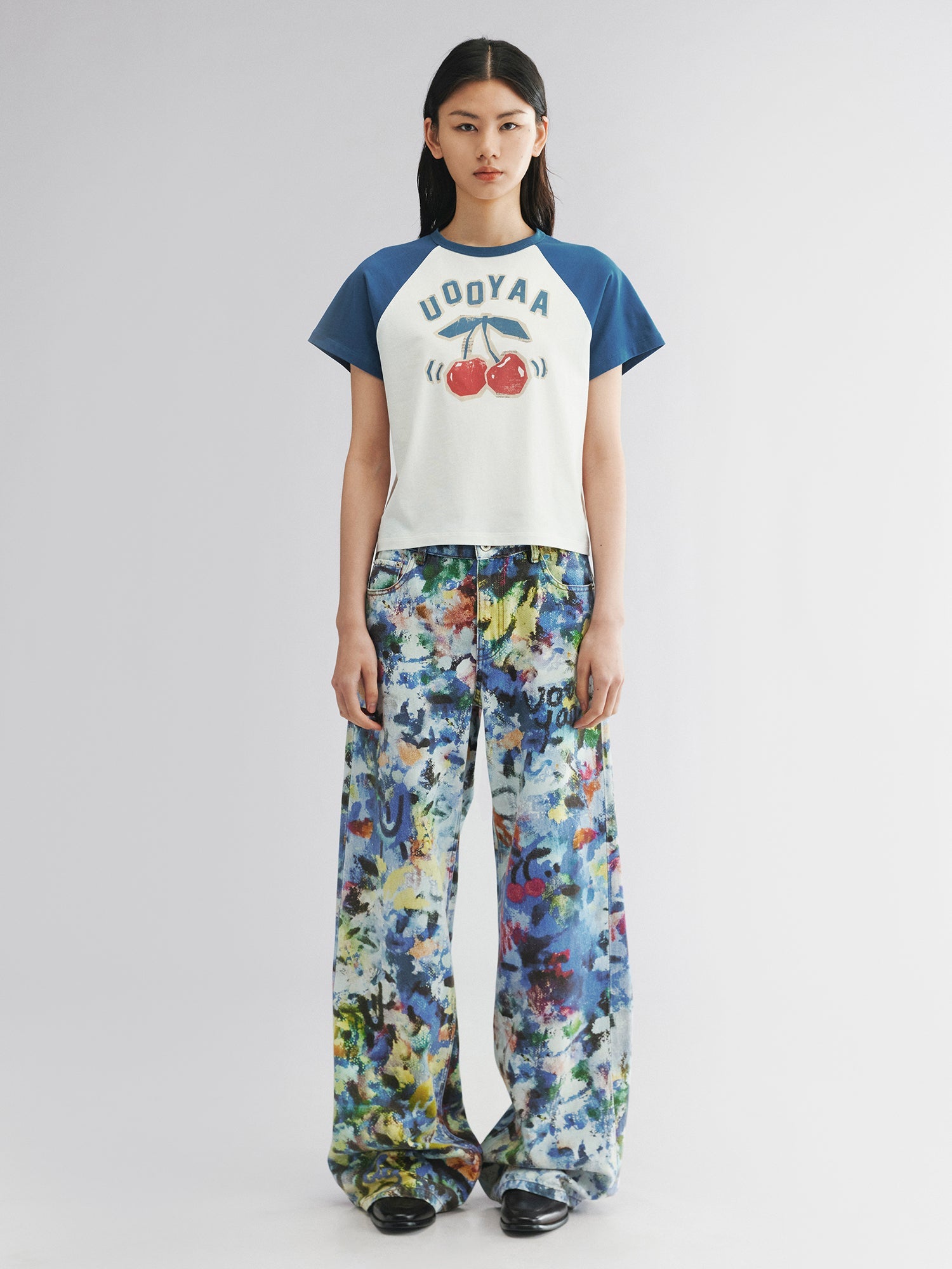 Graffiti-printed denim pants
