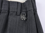 Draped tailored trousers with curved pleats