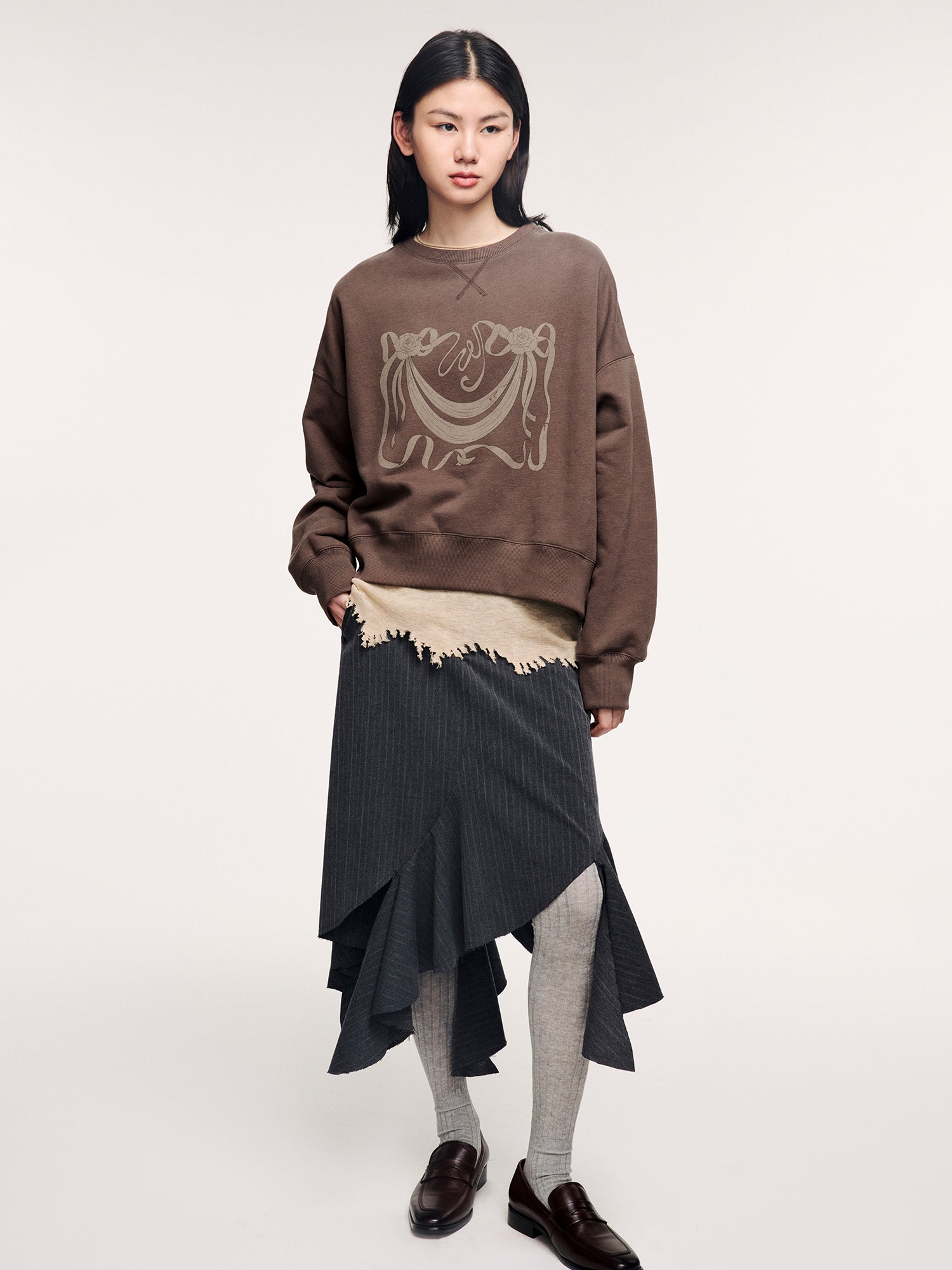 Tailored skirt with asymmetric ruffle trim