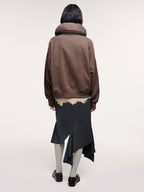 Tailored skirt with asymmetric ruffle trim