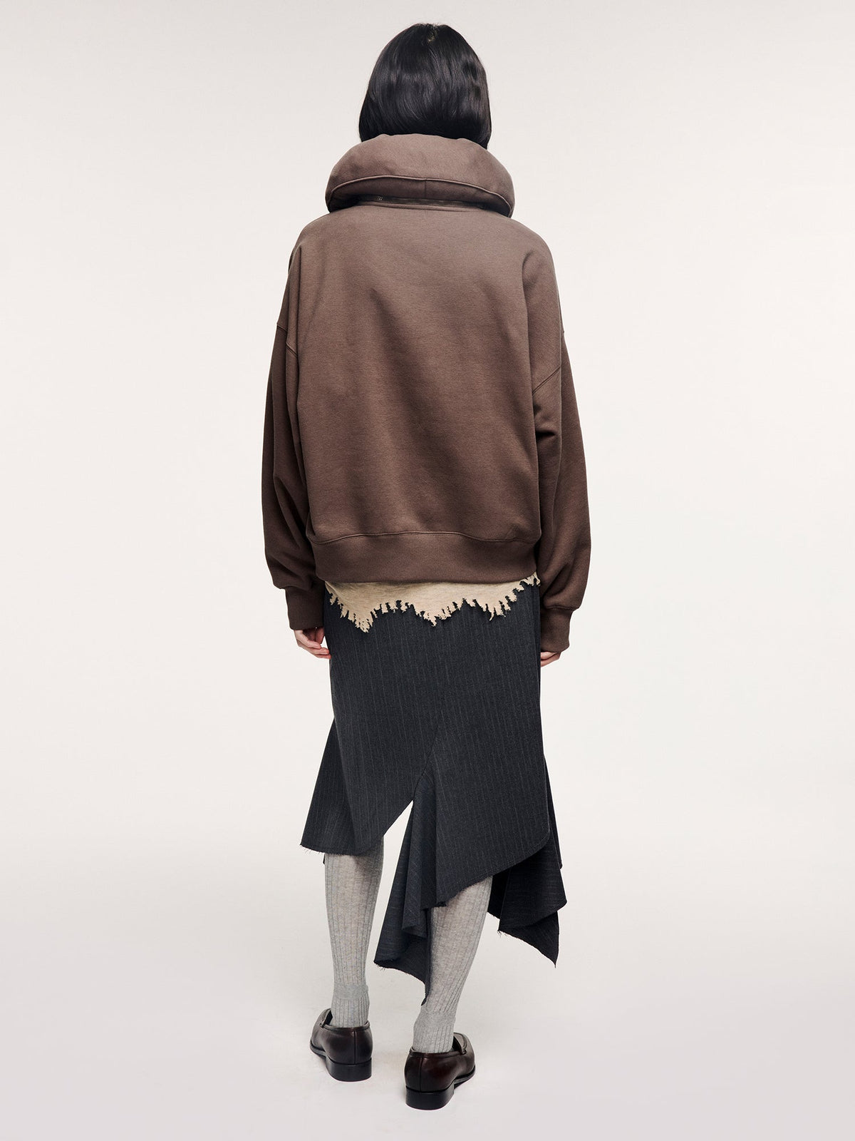 Tailored skirt with asymmetric ruffle trim