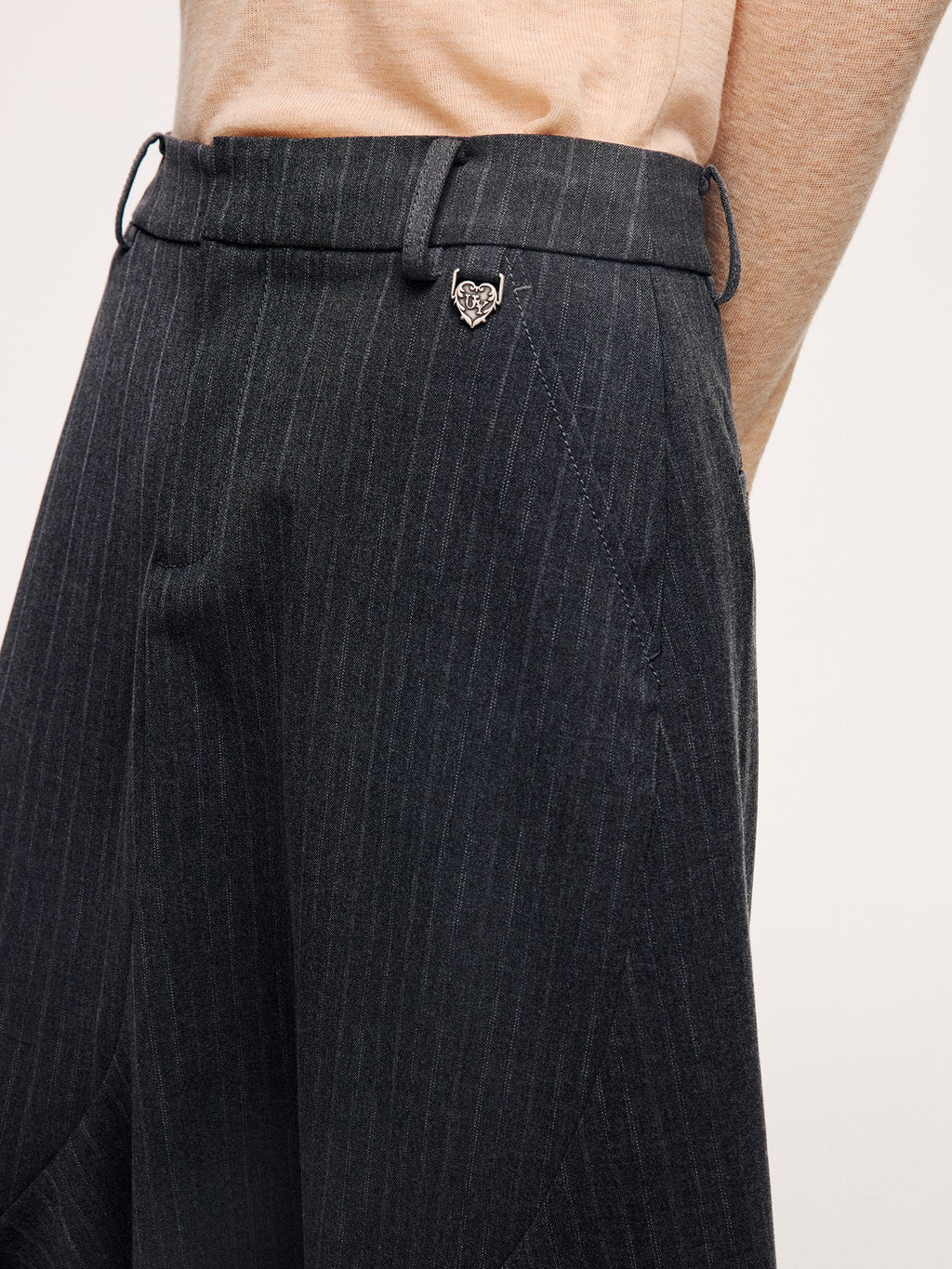 Tailored skirt with asymmetric ruffle trim