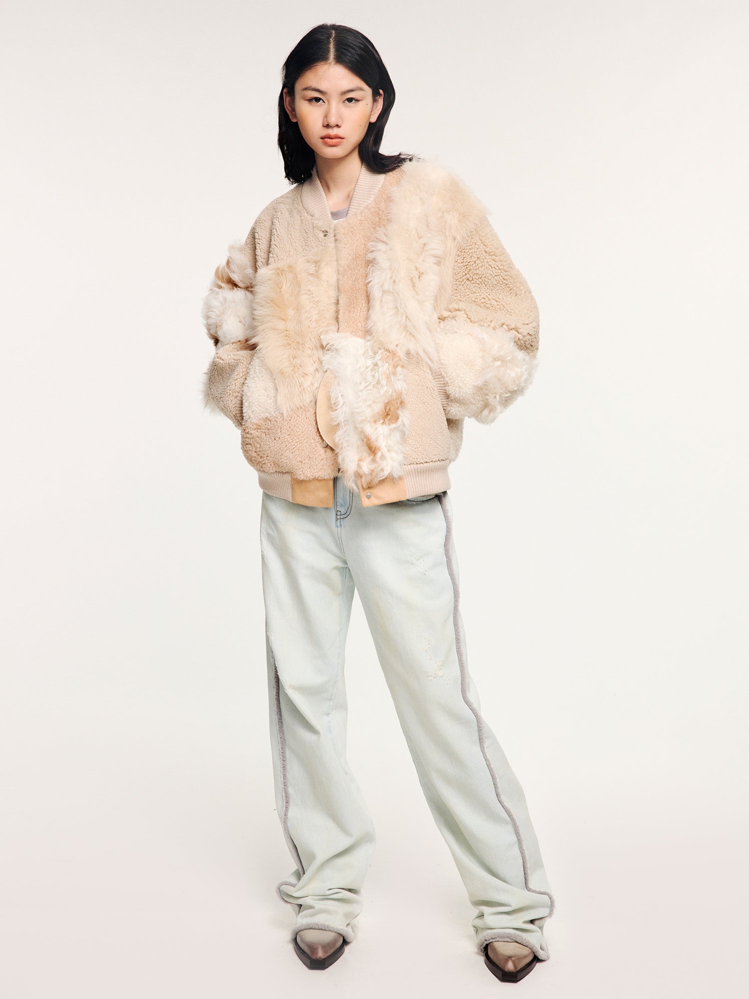 Reversible baseball jacket with shearling leather panels