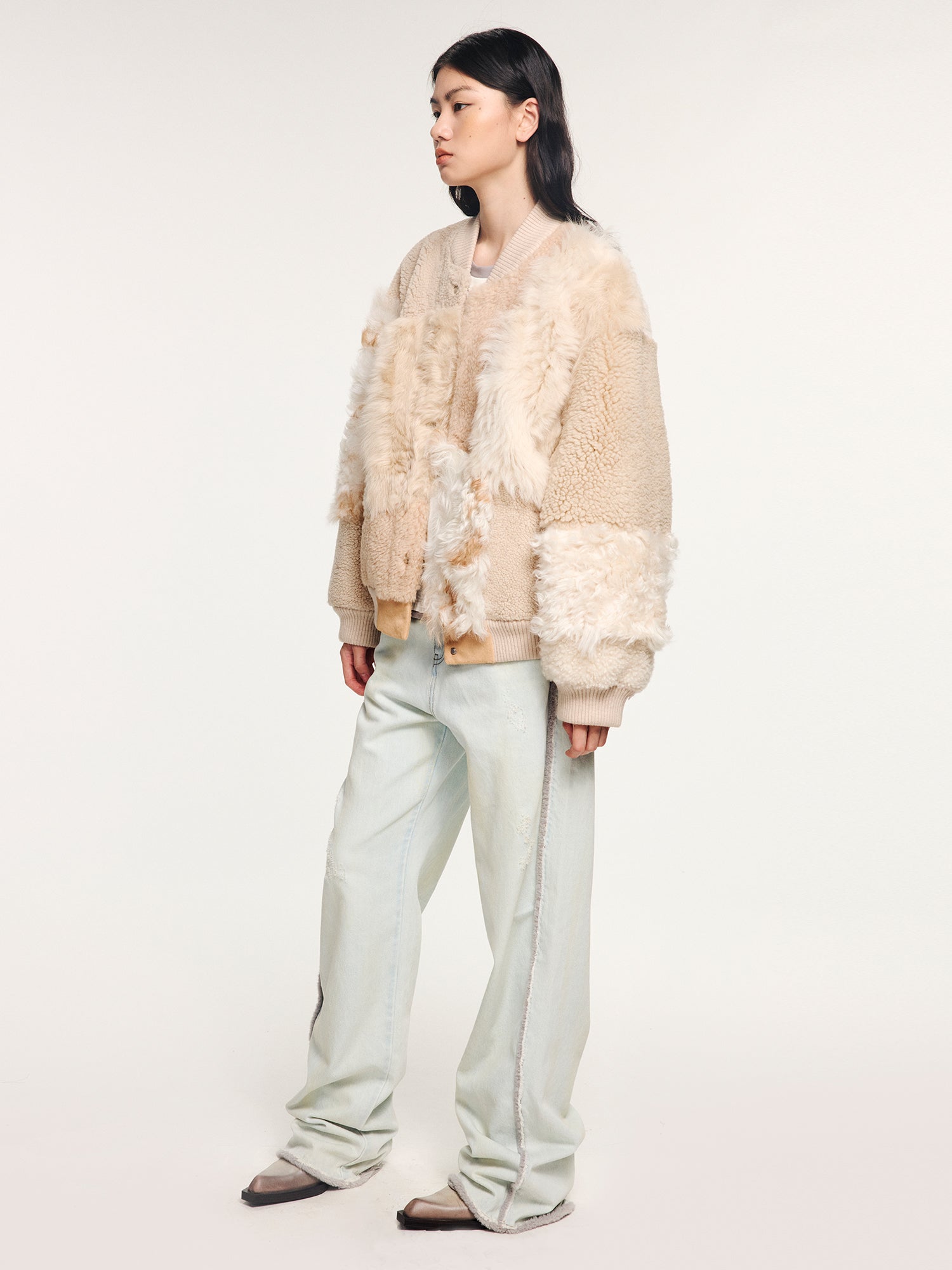 Reversible baseball jacket with shearling leather panels