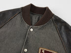 Baseball jacket with leather sleeves and badges