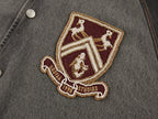 Baseball jacket with leather sleeves and badges