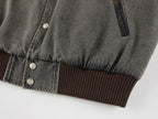 Baseball jacket with leather sleeves and badges