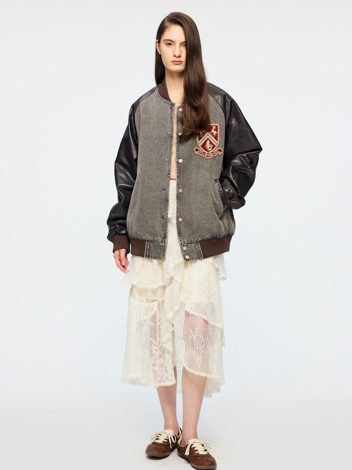 Baseball jacket with leather sleeves and badges