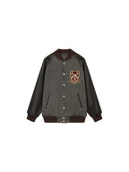 Baseball jacket with leather sleeves and badges