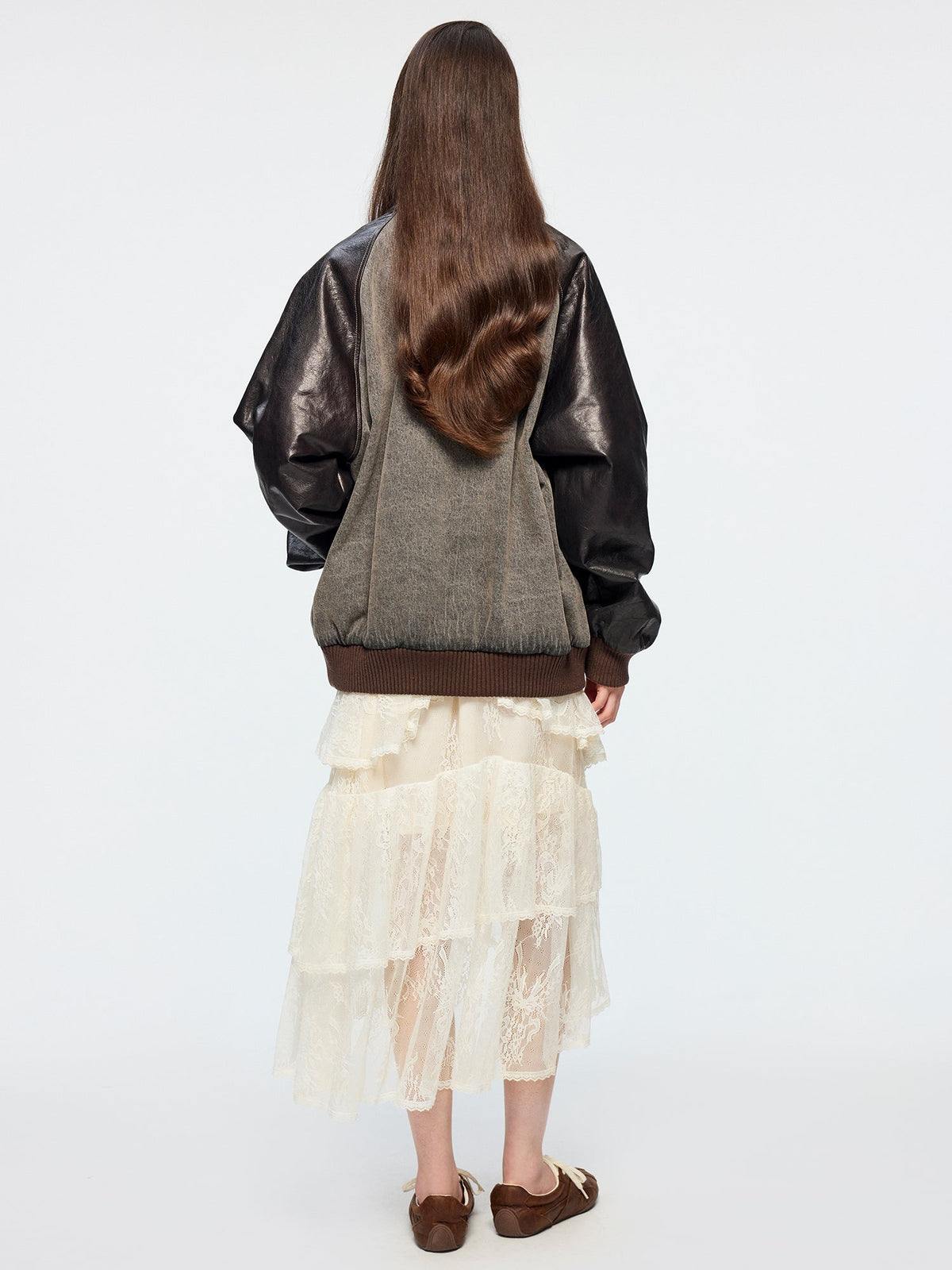 Baseball jacket with leather sleeves and badges