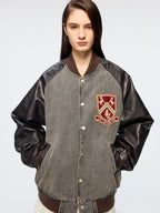 Baseball jacket with leather sleeves and badges