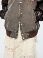 Baseball jacket with leather sleeves and badges