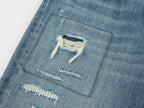 Distressed patchwork jeans