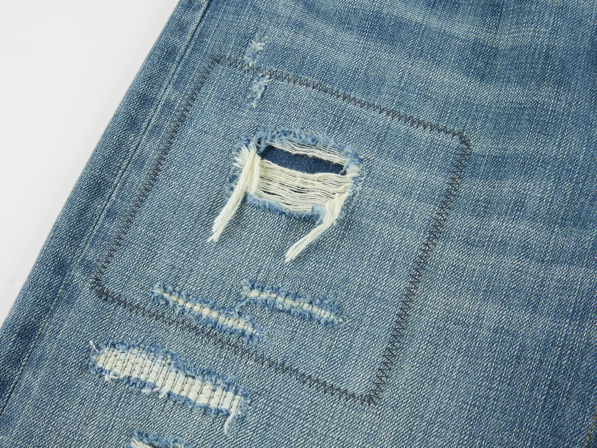 Distressed patchwork jeans