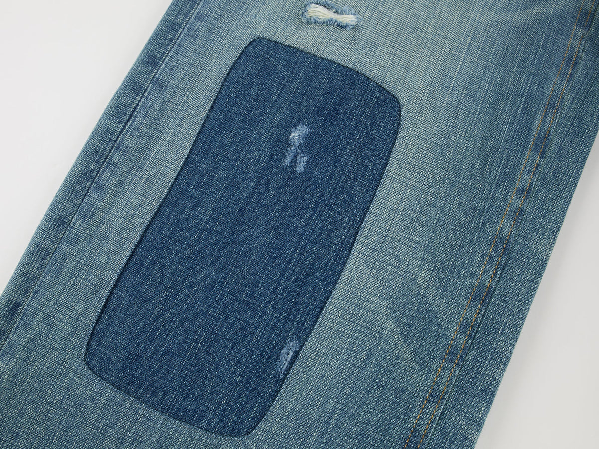 Distressed patchwork jeans