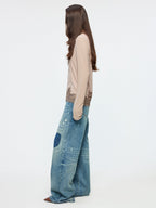 Distressed patchwork jeans