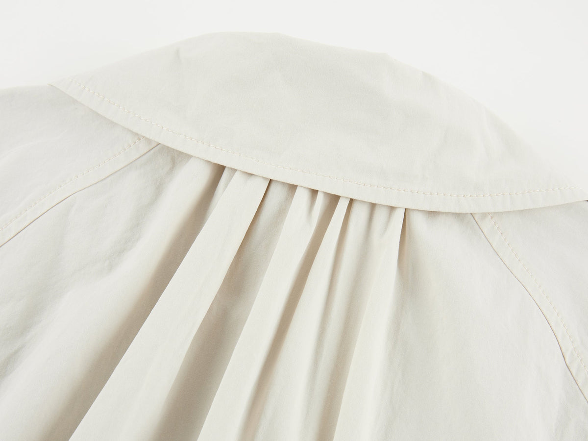Exposed lining cropped balmacaan coat