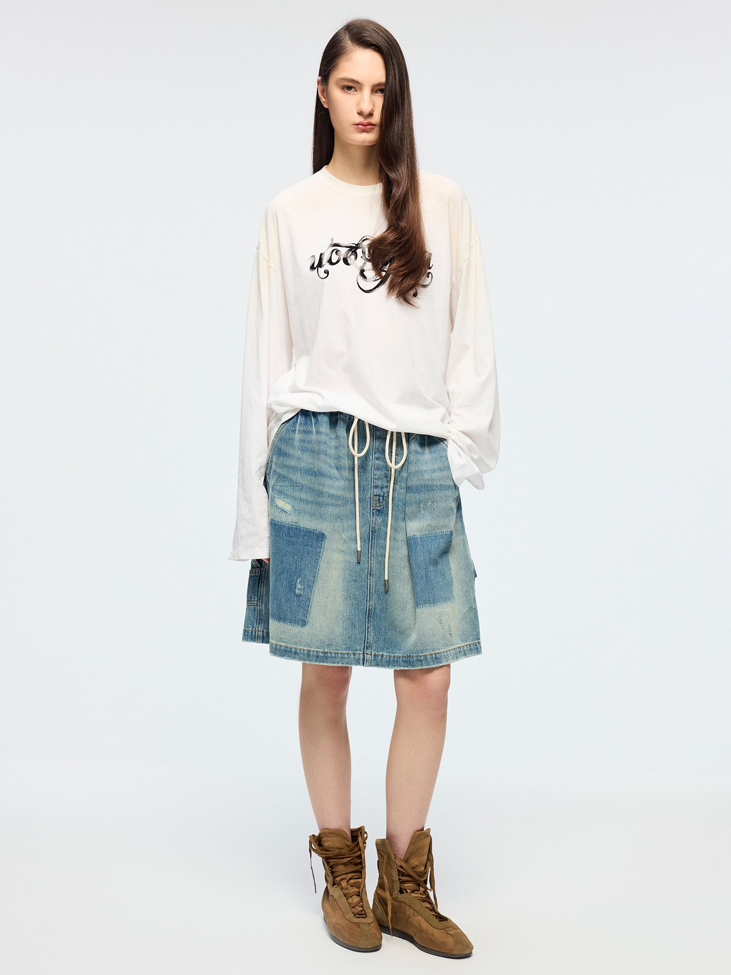 Distressed denim cargo skirt