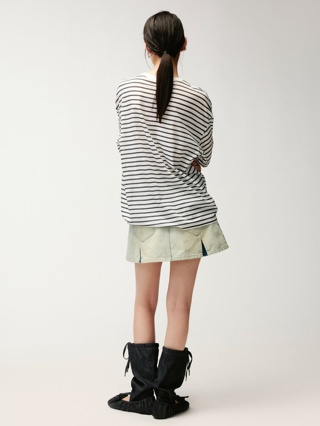 Washed pleated denim mini skirt