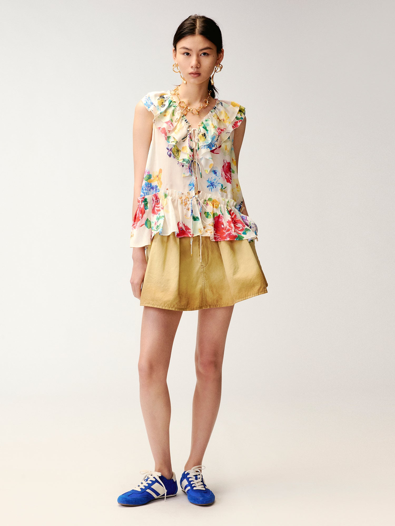 Floral ruffle and insect print vest