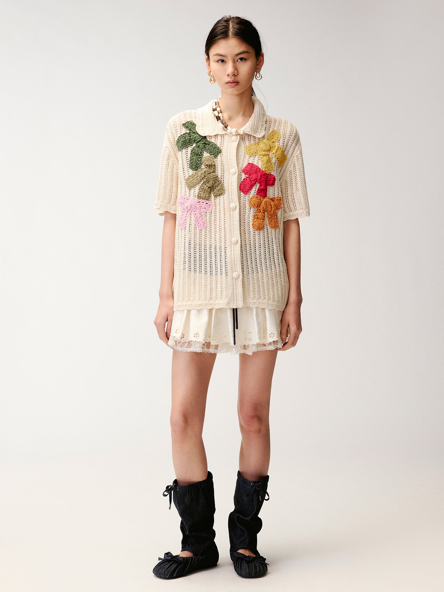 Hand-crocheted bow cardigan