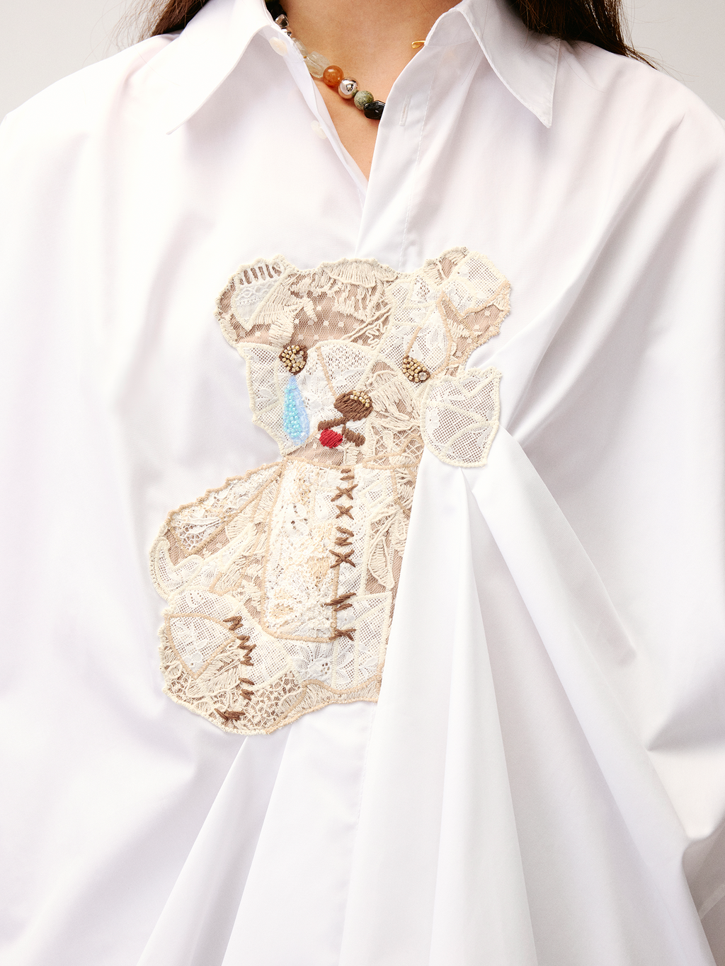 Lace appliqué pleated shirt